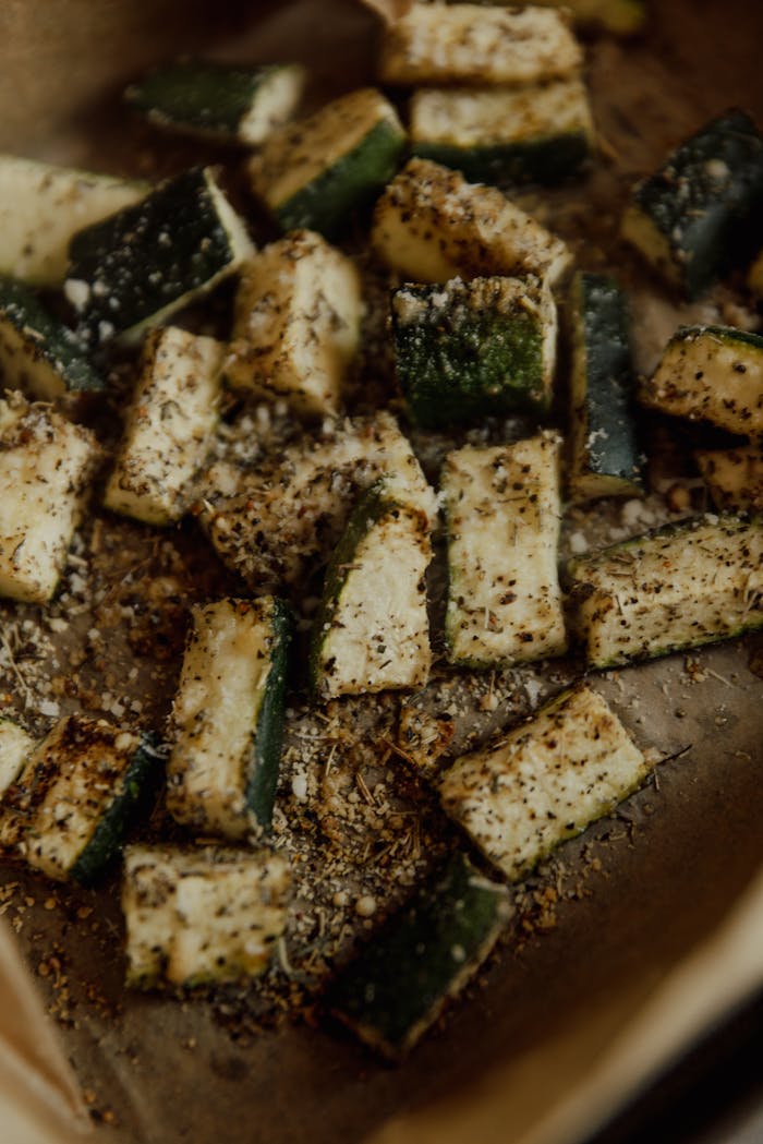 Deliciously seasoned baked zucchini chunks, ideal for vegan and vegetarian diets.
